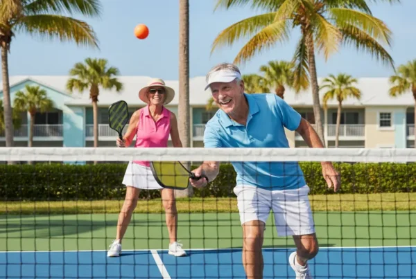 Active seniors playing pickleball after non-surgical knee pain treatment in The Villages, FL.